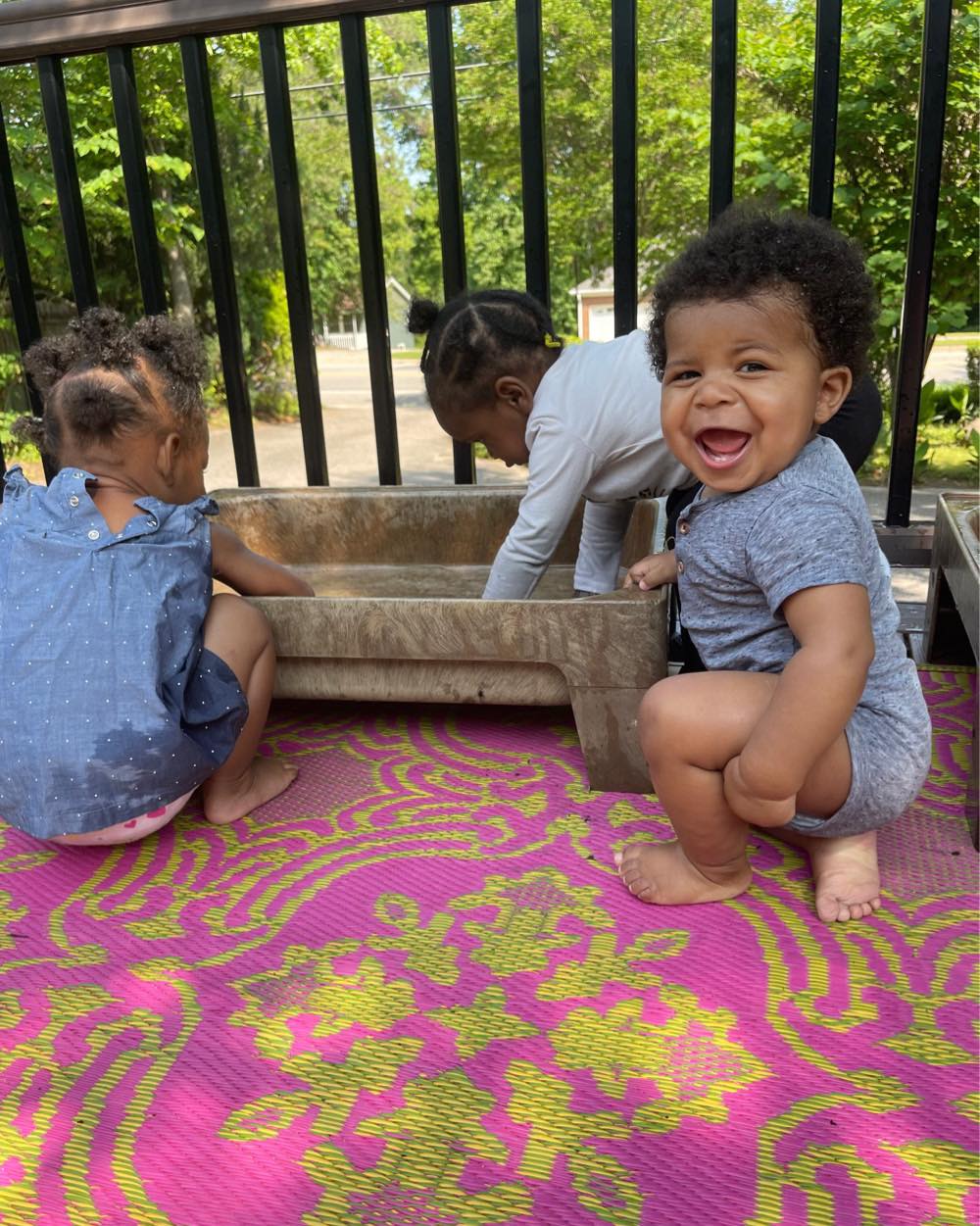 babies at toddlers at the water table